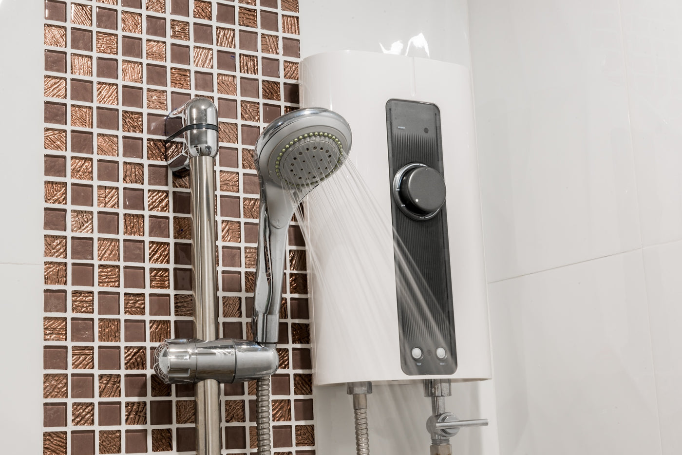 Electric shower unit with an adjustable temperature control and handheld shower head, delivering a steady flow of water during use.