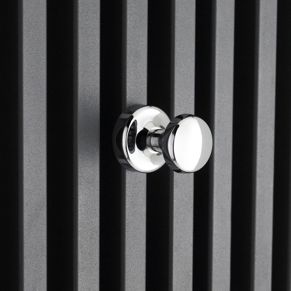 Chrome robe hook radiator accessory on a black radiator