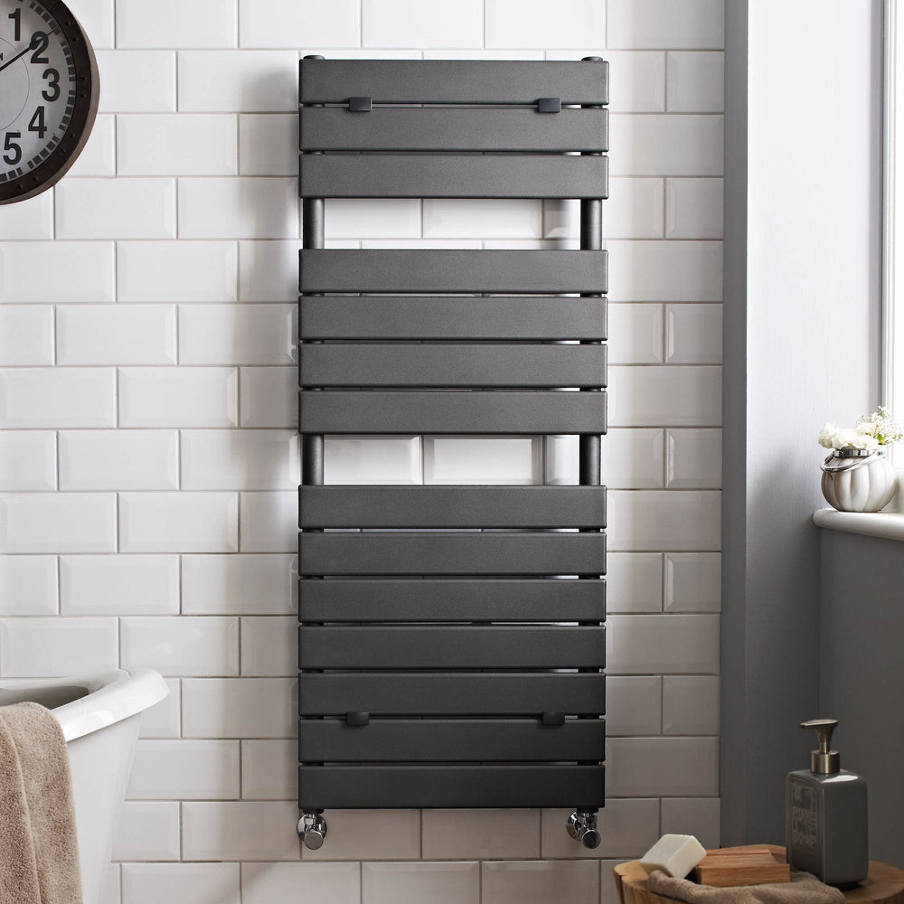 Example of a black towel rail in a luxury white tiled bathroom