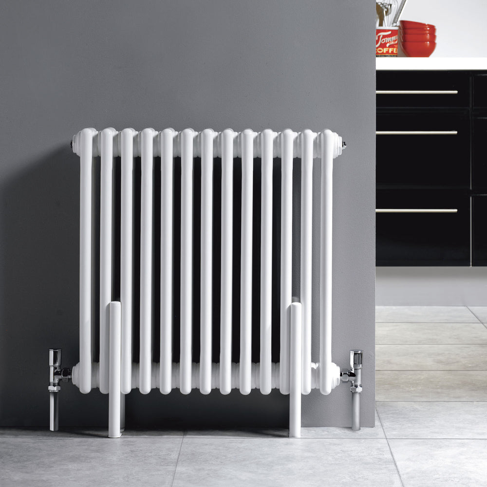 Traditional style white radiator in living room and kitchen