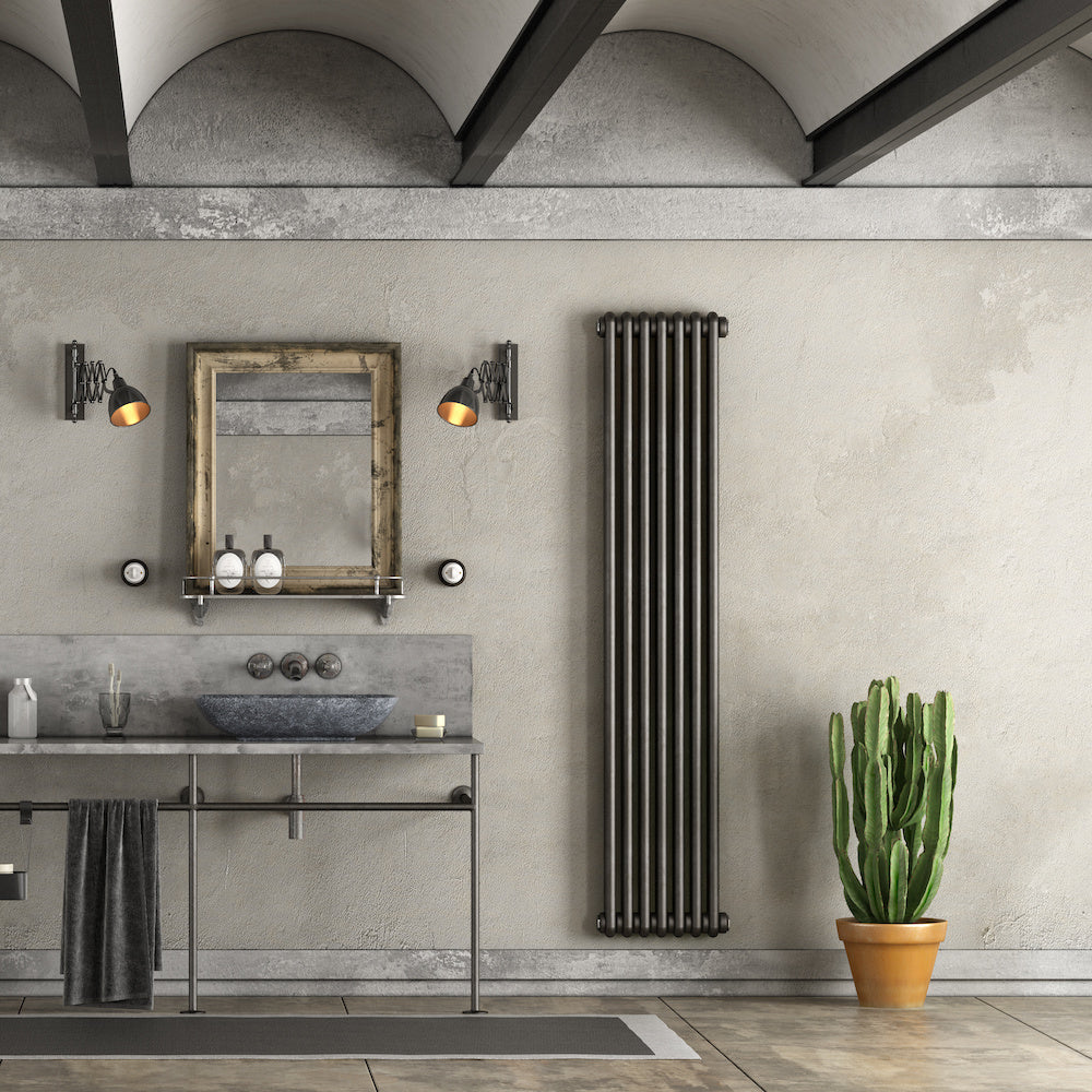 Dark luxury bathroom with black radiator and industrial taps