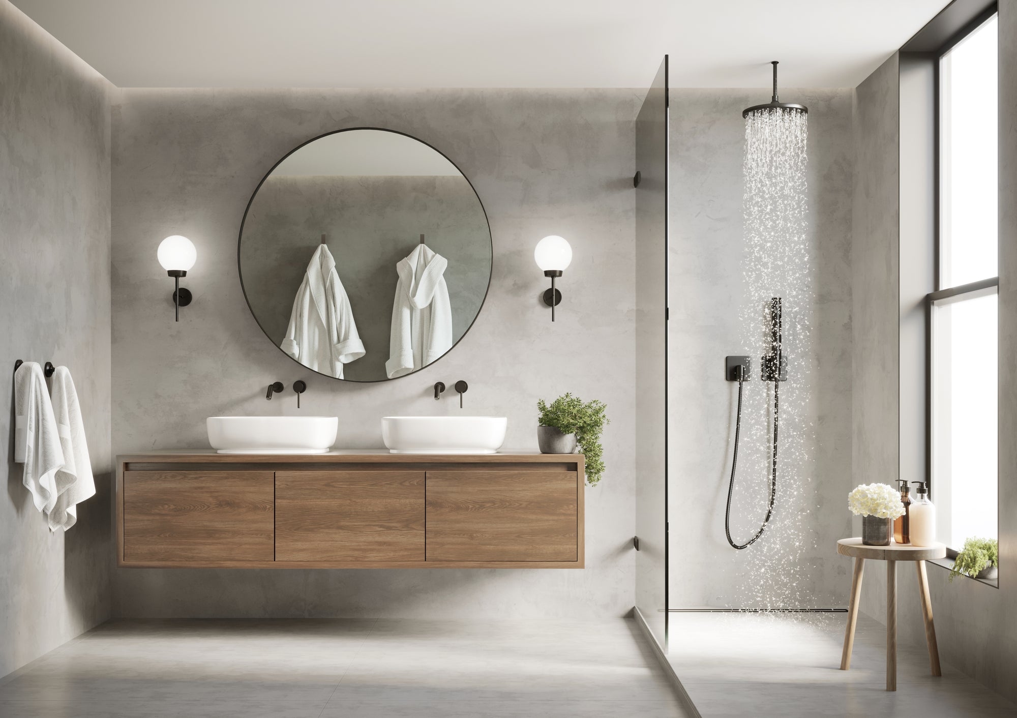 Luxury concrete bathroom with wooden vanity unit and black shower units and taps